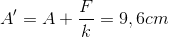 A'=A+\frac{F}{k}=9,6cm