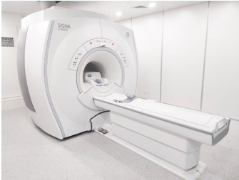 A mri machine in a room
AI-generated content may be incorrect.