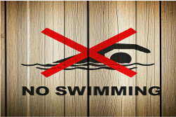 A no swimming sign on a wood wall
AI-generated content may be incorrect.