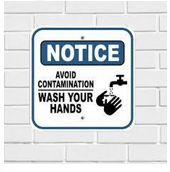 A white and blue sign on a white brick wall

AI-generated content may be incorrect.