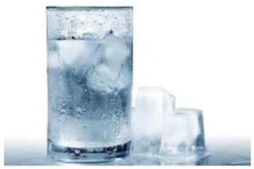 A glass of ice water and ice cubes
AI-generated content may be incorrect.